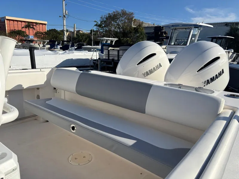 Slide: The Image of 2022 Robalo R242 boat with Yamaha engines, featuring a sleek seating area. - 28
