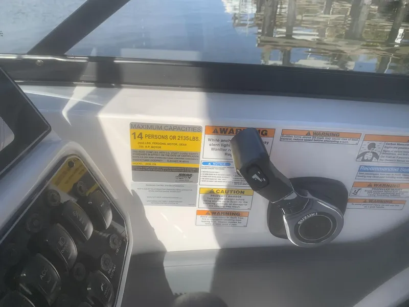 Slide: The Image of Control panel of 2025 Hurricane SD 2050 boat with capacity and warning labels. - 11