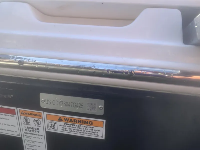 Slide: The Image of Boat warning labels and identification plate on a 2025 Hurricane SD 2050. - 12