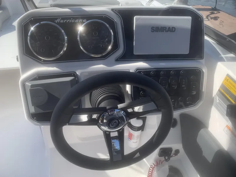 Slide: The Image of Steering console of 2025 Hurricane SD 2050 boat with Simrad display and gauges. - 3