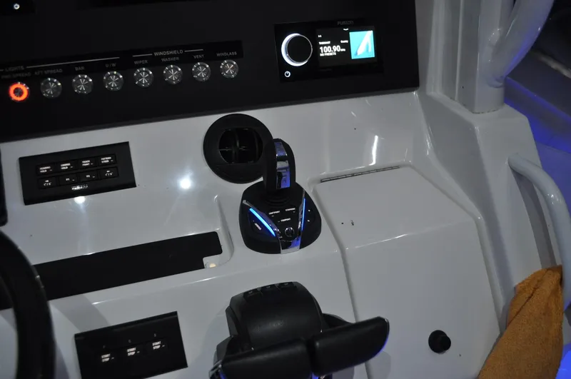 Slide: The Image of Control panel of 2023 Regulator 34 boat with modern navigation display. - 18