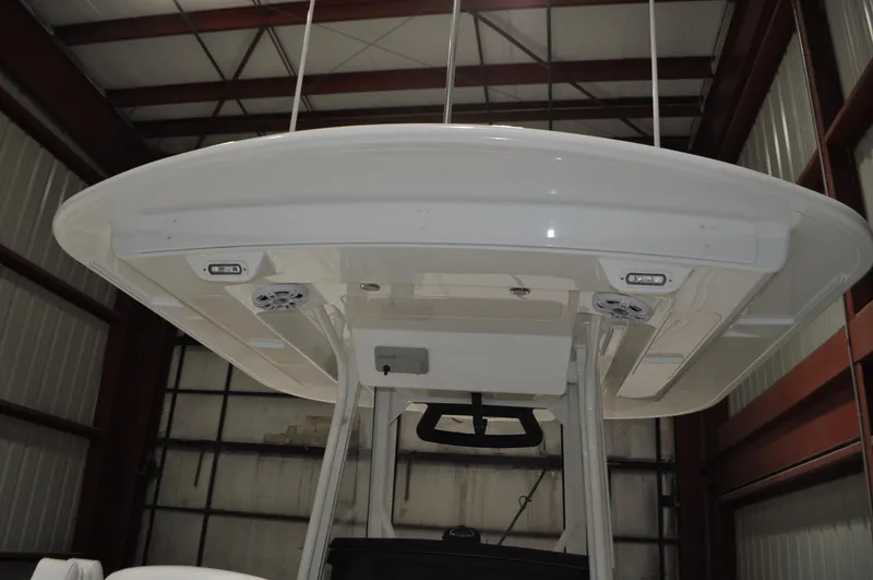 Slide: The Image of 2023 Regulator 34 boat underside view in storage facility. - 19