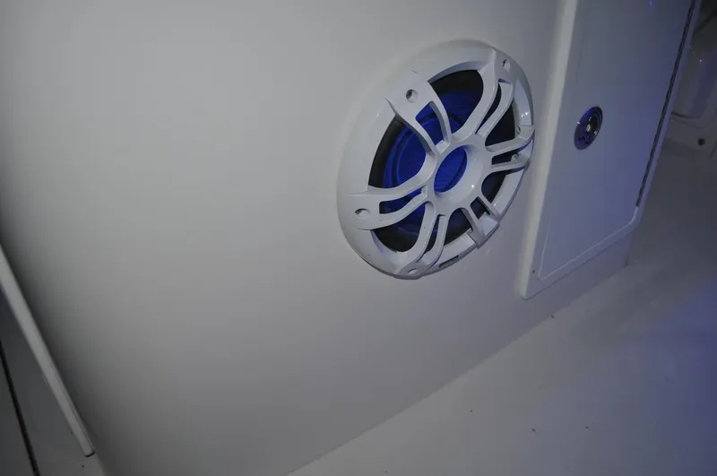 Slide: The Image of Speaker on 2023 Regulator 34 boat interior, featuring sleek white design. - 20