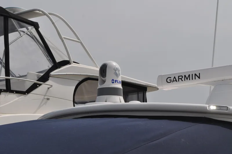 Slide: The Image of 2023 Regulator 34 boat with FLIR and Garmin equipment on deck. - 26