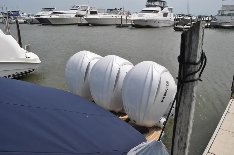 Slide: The Image of 2023 Regulator 34 boat with Yamaha engines docked at marina. - 28
