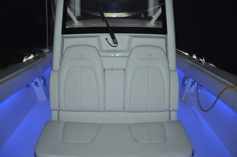 Slide: The Image of 2023 Regulator 34 boat interior with illuminated seating and modern design. - 30