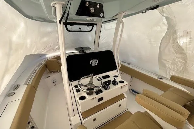 Slide: The Image of 2023 Sportsman Open 282 Center Console interior with helm and seating. - 34