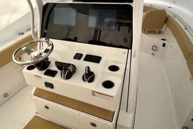 Slide: The Image of 2023 Sportsman Open 282 Center Console helm with dual screens and controls. - 36