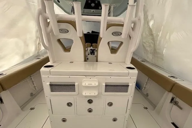 Slide: The Image of 2023 Sportsman Open 282 Center Console interior with seating and storage compartments. - 37