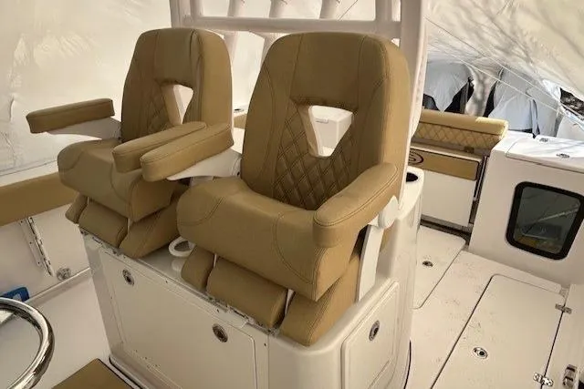 Slide: The Image of 2023 Sportsman Open 282 Center Console with tan cushioned seats and armrests. - 39