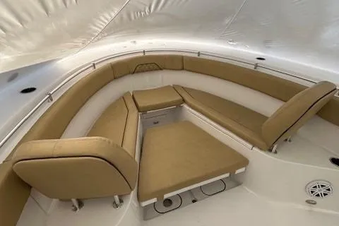 Slide: The Image of 2023 Sportsman Open 282 Center Console boat interior with tan seating. - 41