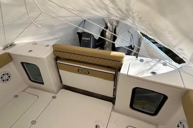 Slide: The Image of 2023 Sportsman Open 282 Center Console boat interior with seating and storage. - 43