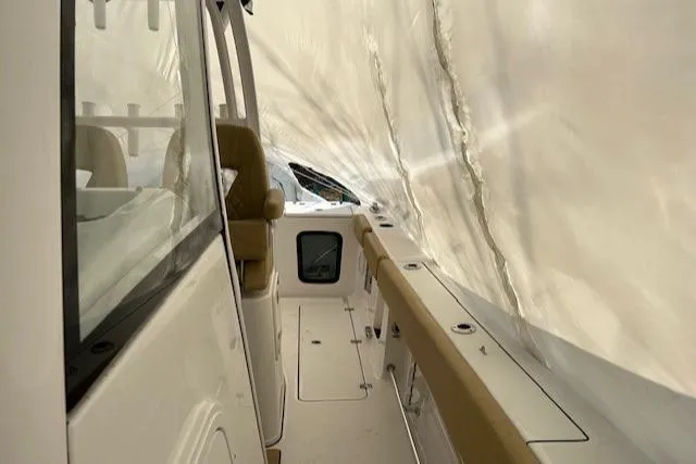 Slide: The Image of 2023 Sportsman Open 282 Center Console boat under protective cover. - 45