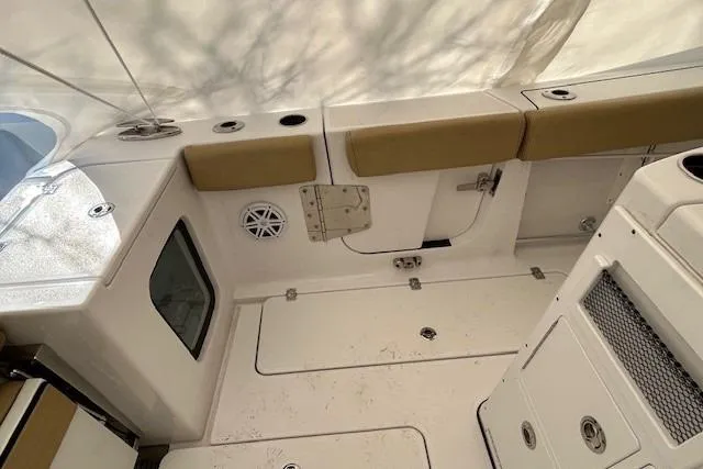 Slide: The Image of 2023 Sportsman Open 282 Center Console interior with seating and storage compartments. - 48