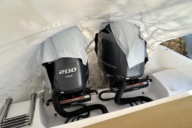 Slide: The Image of 2023 Sportsman Open 282 Center Console with twin Yamaha 200 engines under cover. - 49