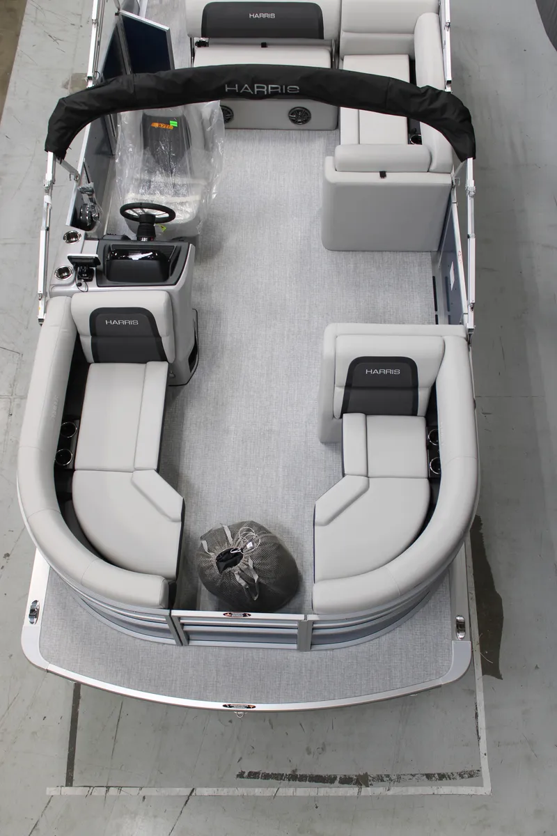 Slide: The Image of 2025 Harris Cruiser 210 SL pontoon boat with spacious seating and modern design. - 6