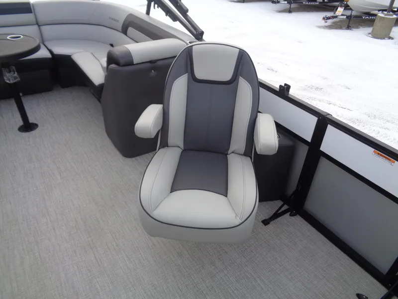 Slide: The Image of 2023 Viaggio LAGO V 22E boat interior with gray captain's chair and seating. - 12