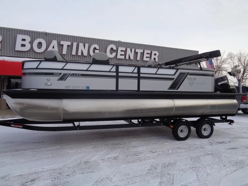 Slide: The Image of 2023 Viaggio LAGO V 22E pontoon boat on trailer at boating center. - 2