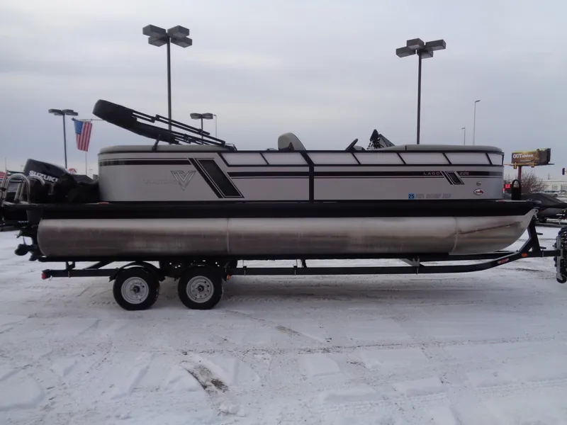Slide: The Image of 2023 Viaggio LAGO V 22E pontoon boat on trailer in snowy parking lot. - 3