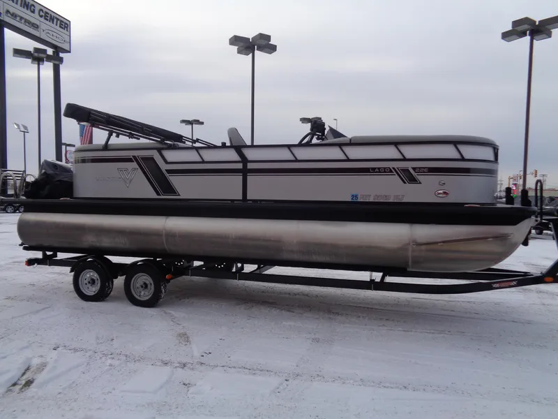 Slide: The Image of 2023 Viaggio LAGO V 22E pontoon boat on trailer in snowy parking lot. - 4