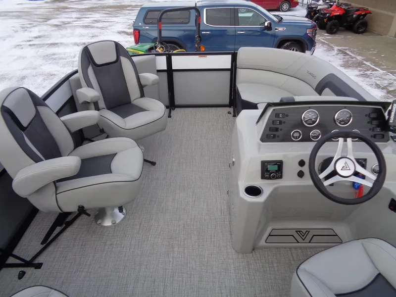 Slide: The Image of 2023 Viaggio LAGO V 22E pontoon boat interior with modern seating and control panel. - 7