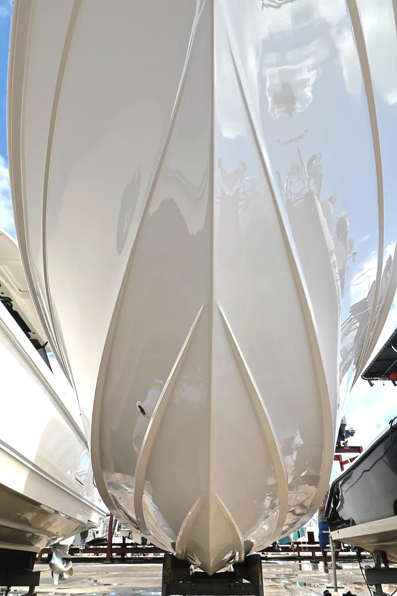Slide: The Image of 2004 Marlago 35 Sport Cuddy boat hull, showcasing sleek design and craftsmanship. - 19