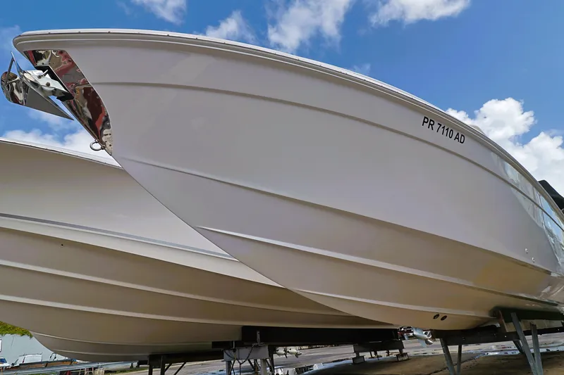 Slide: The Image of 2004 Marlago 35 Sport Cuddy boat on trailer under blue sky. - 20
