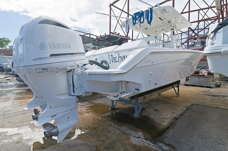 Slide: The Image of 2004 Marlago 35 Sport Cuddy boat with Yamaha outboard engine in a marina setting. - 5