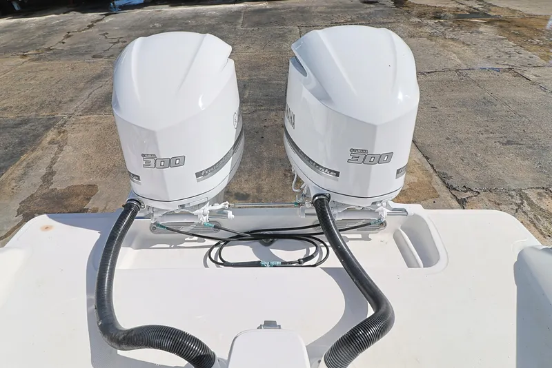 Slide: The Image of Twin outboard engines on a 2004 Marlago 35 Sport Cuddy boat, viewed from above. - 6