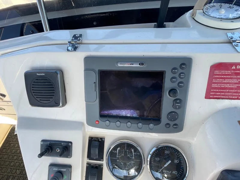 Slide: The Image of Control panel of 2005 Mainship 430 Aft Cabin 3SR Trawler with navigation equipment. - 21