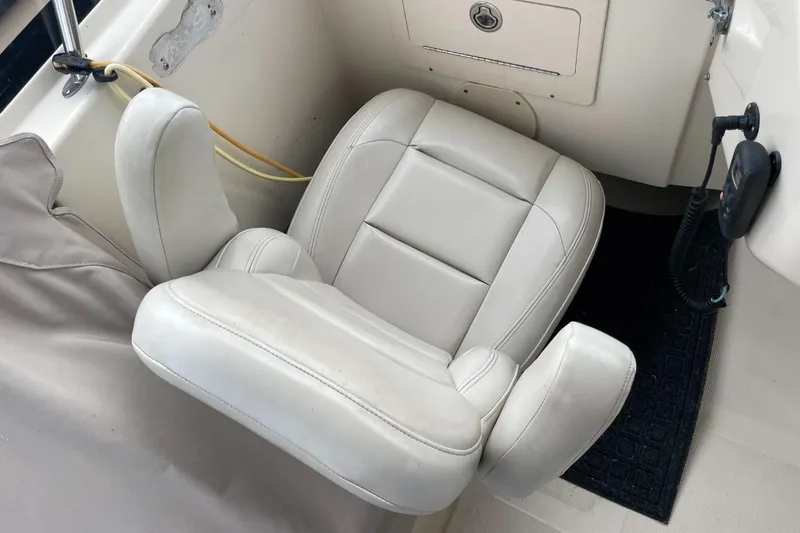 Slide: The Image of White leather captain's chair on 2005 Mainship 430 Aft Cabin 3SR Trawler. - 25