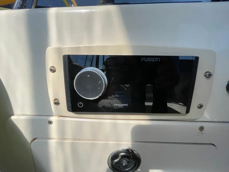 Slide: The Image of Control panel on 2005 Mainship 430 Aft Cabin 3SR Trawler, featuring Fusion audio system. - 29