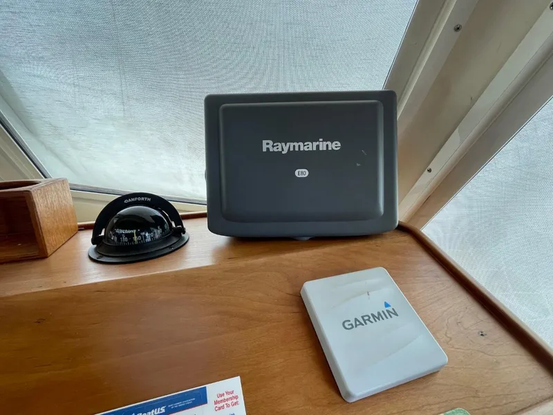 Slide: The Image of Raymarine and Garmin navigation equipment on 2005 Mainship 430 Aft Cabin Trawler. - 35