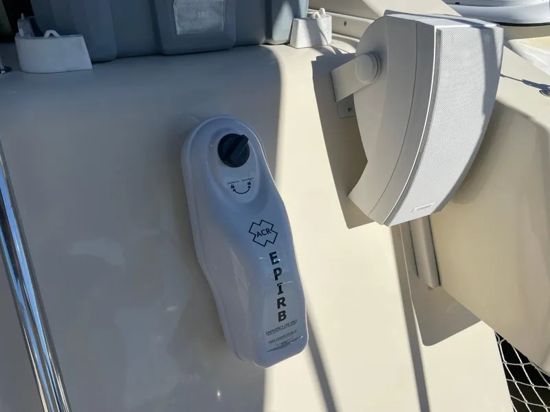 Slide: The Image of EPIRB device on 2005 Mainship 430 Aft Cabin Trawler, mounted near a speaker. - 47