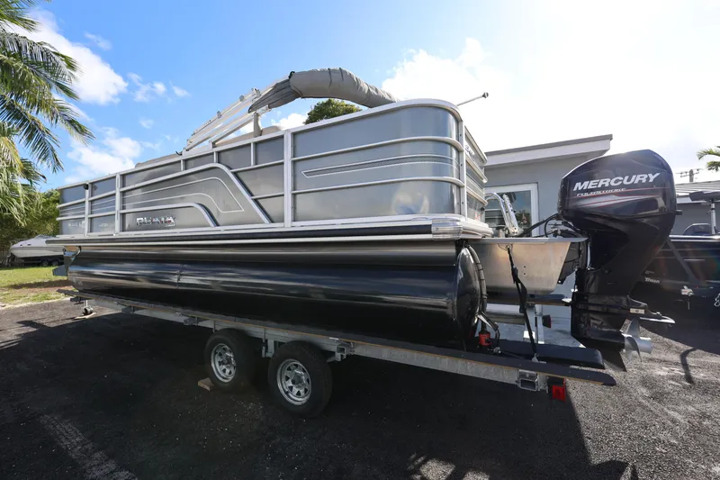 Slide: The Image of 2017 Ranger Reata 200F pontoon boat on trailer with Mercury outboard motor. - 19