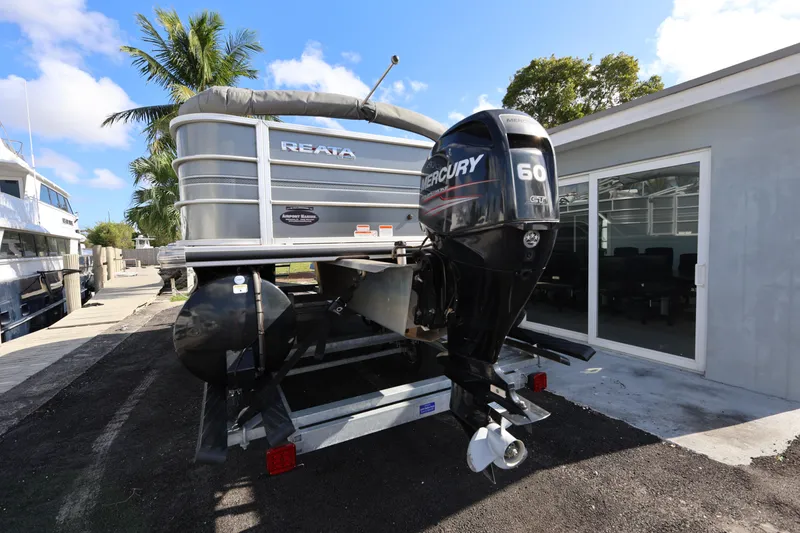 Slide: The Image of 2017 Ranger Reata 200F boat with Mercury 60 engine, parked outdoors. - 20