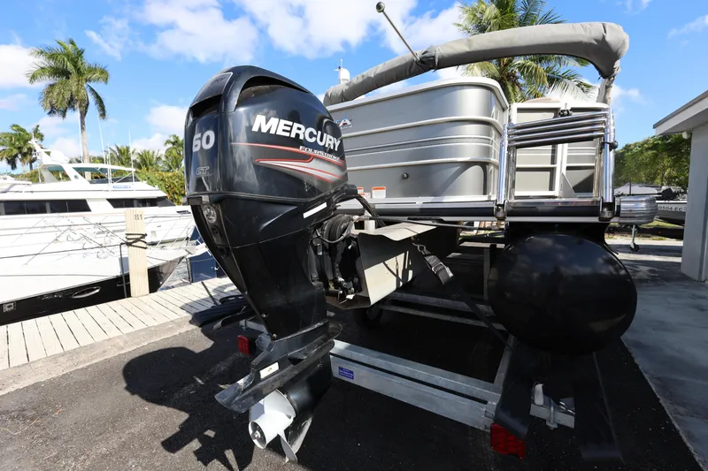 Slide: The Image of 2017 Ranger Reata 200F pontoon boat with Mercury 60 outboard motor on trailer. - 21