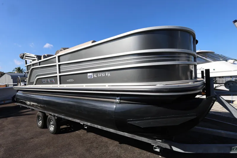 Slide: The Image of 2017 Ranger Reata 200F pontoon boat on trailer, side view. - 23