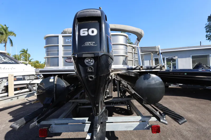 Slide: The Image of 2017 Ranger Reata 200F boat with Mercury 60 outboard motor, parked on trailer. - 26