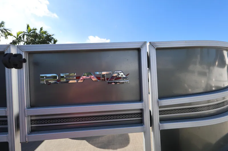 Slide: The Image of 2017 Ranger Reata 200F boat emblem with blue sky background. - 28