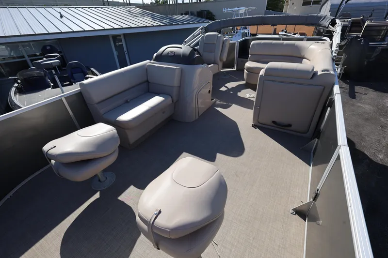 Slide: The Image of 2017 Ranger Reata 200F boat interior with beige seating and spacious layout. - 30