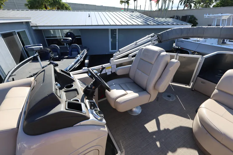 Slide: The Image of 2017 Ranger Reata 200F boat interior with steering console and seating. - 32