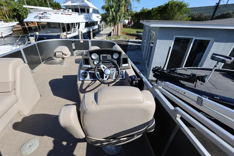 Slide: The Image of 2017 Ranger Reata 200F boat interior with steering console and seating. - 36