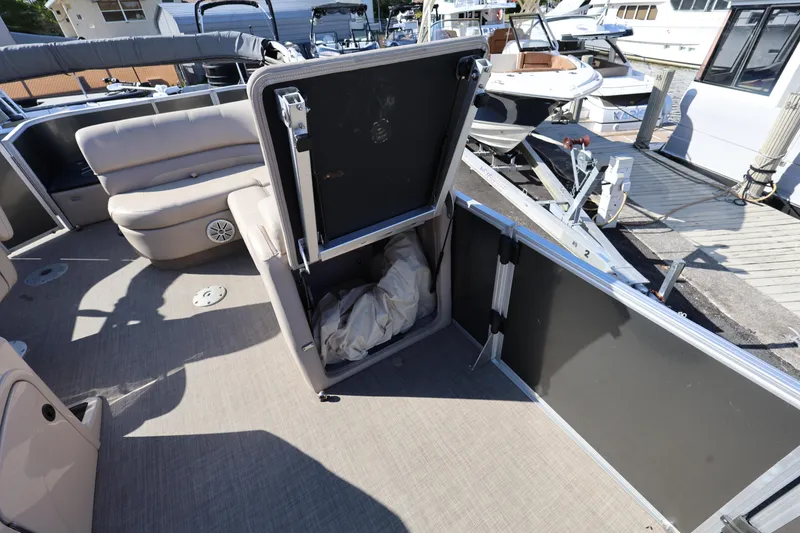 Slide: The Image of 2017 Ranger Reata 200F boat interior with open storage compartment and seating area. - 39