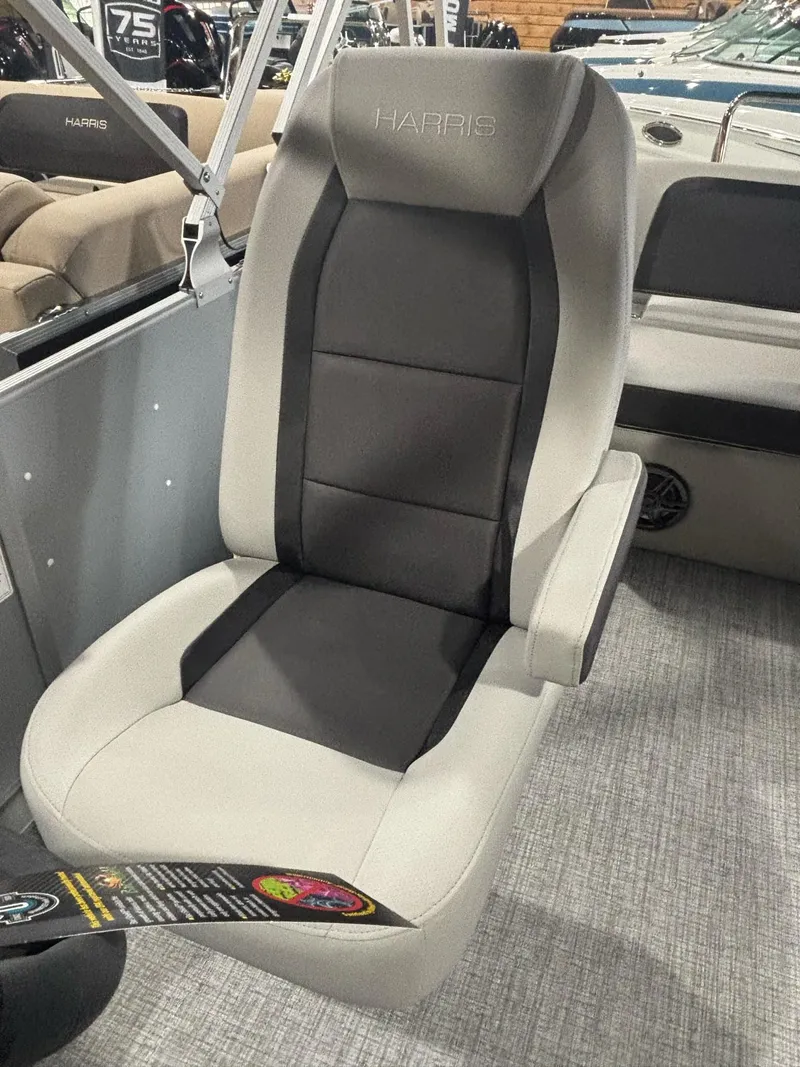 Slide: The Image of 2025 Harris CRUISER 230 SL boat seat, gray and black upholstery, modern design. - 10