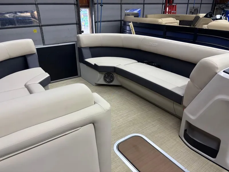 Slide: The Image of 2025 Harris CRUISER 230 SL interior with beige seating and modern design. - 9