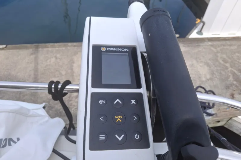 Slide: The Image of Control panel of a 2017 Nimbus 405 Flybridge boat with Cannon display and buttons. - 10
