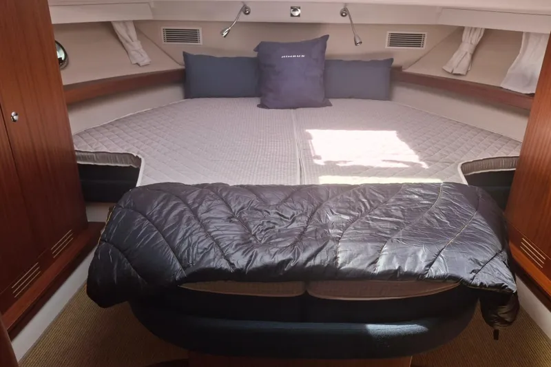 Slide: The Image of Luxurious cabin interior of 2017 Nimbus 405 Flybridge yacht with cozy bedding. - 12