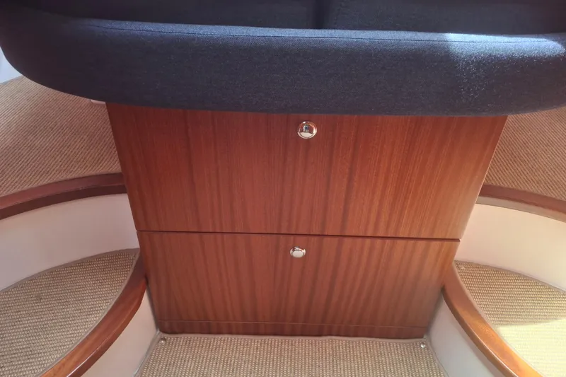 Slide: The Image of Interior of 2017 Nimbus 405 Flybridge with wooden cabinetry and cushioned seating. - 13