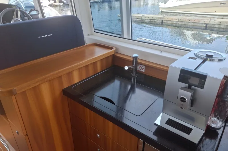 Slide: The Image of Interior of 2017 Nimbus 405 Flybridge yacht with sink and coffee machine. - 25